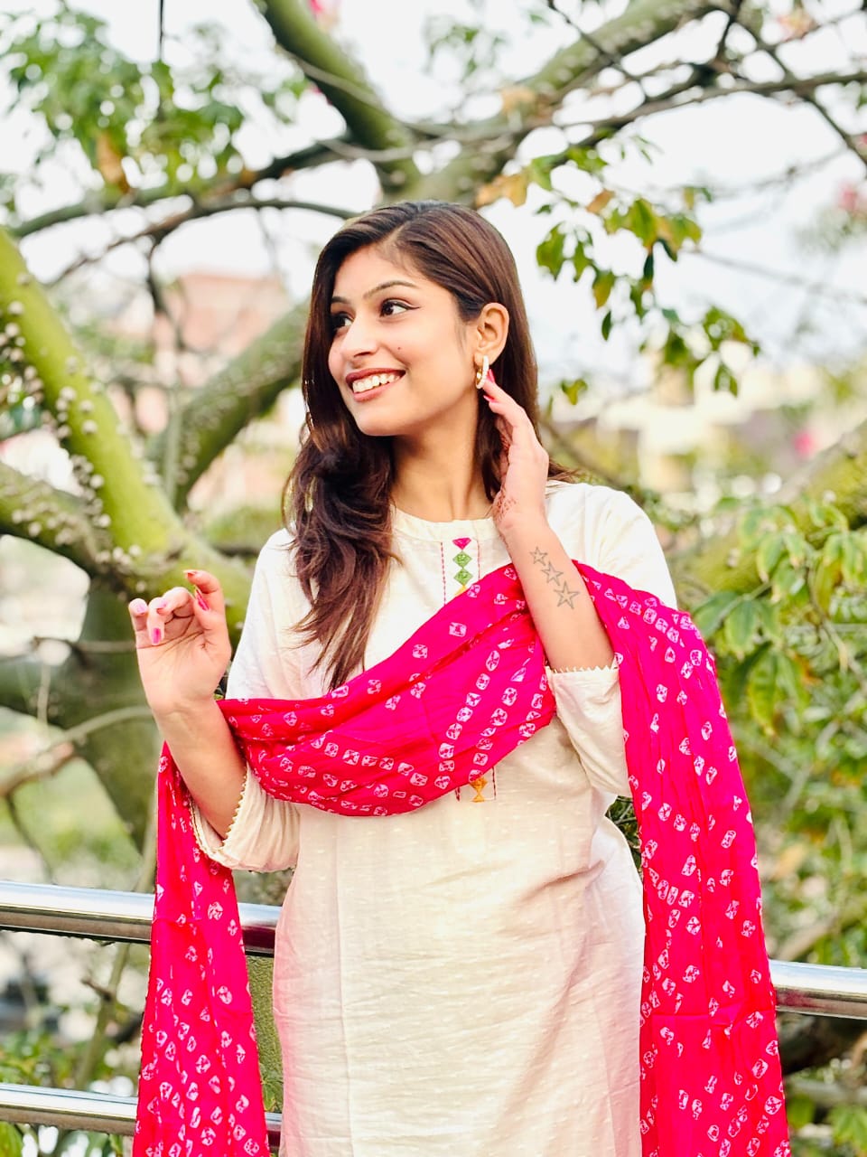 Woman In Traditional Indian Attire Or Embroidered Kurta Set With pink Bandhej Dupatta Set