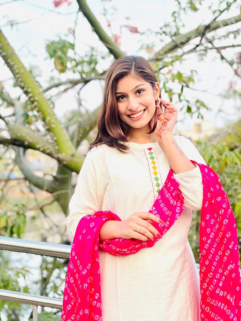 Woman In Traditional Indian Attire Or Embroidered Kurta Set With pink Bandhej Dupatta Set