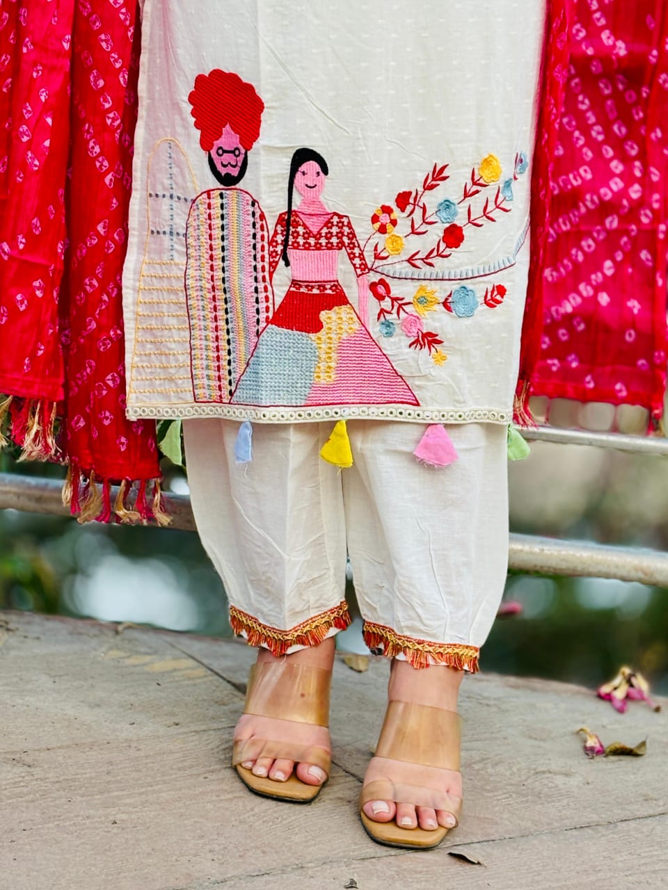 Woman In Traditional Indian Attire Or Embroidered Kurta Set With pink Bandhej Dupatta Set
