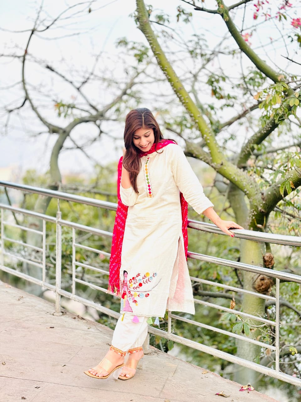 Woman In Traditional Indian Attire Or Embroidered Kurta Set With pink Bandhej Dupatta Set